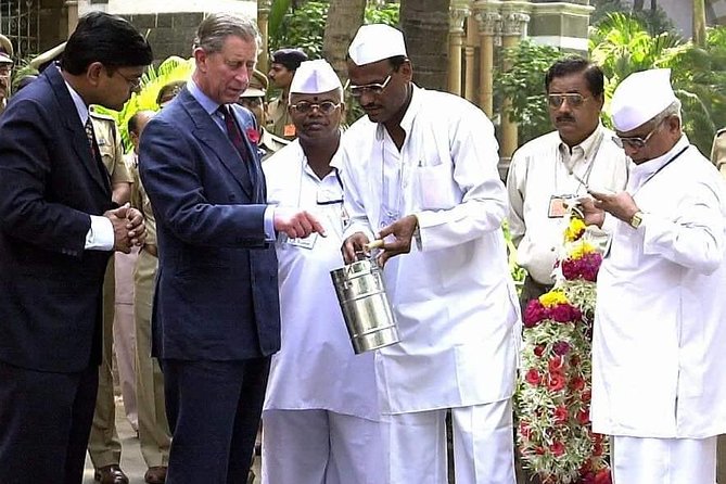 Dabbawala, Dhobi Ghat & Dharavi slum Tour with Local Train Ride - Stop 3: Dabbawala tribute statue, and the lunch network you never see