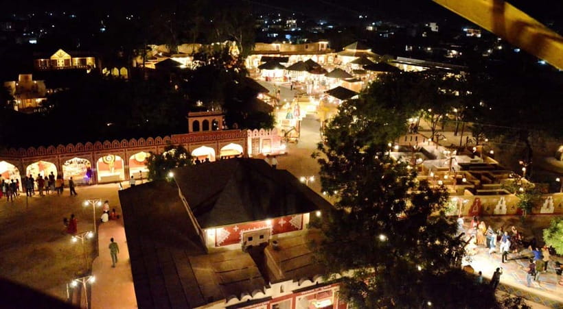 Jaipur: Cultural Evening Tour & Dinner at Chokhi Dhani - Inside Kalagram Chokhi Dhani: huts, crafts, and free wandering time