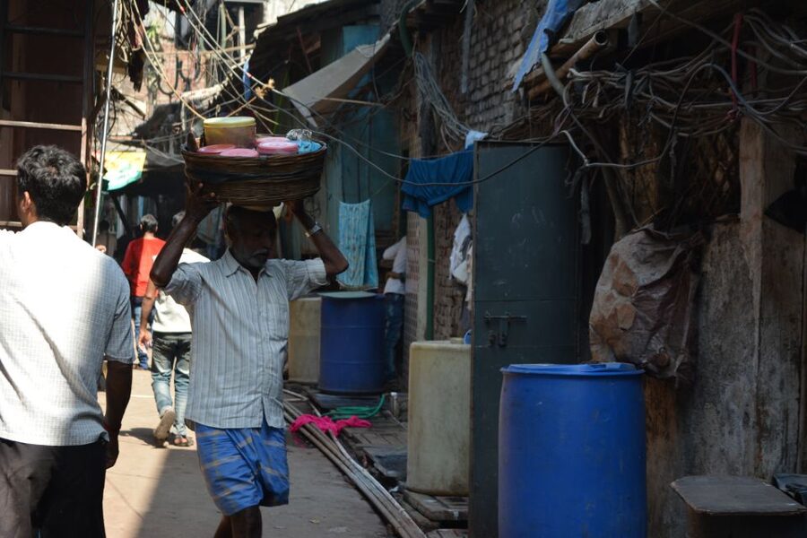 Mumbai: Dharavi Slum Tour with Dhobi Ghat (Open-Air Laundry) - The market stop feel: handicrafts and textiles you can actually picture