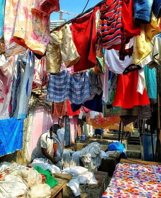 Mumbai: Private Dhobi Ghat Laundry & Slum Tour with Pickup - Dharavi with a local English guide, not a script