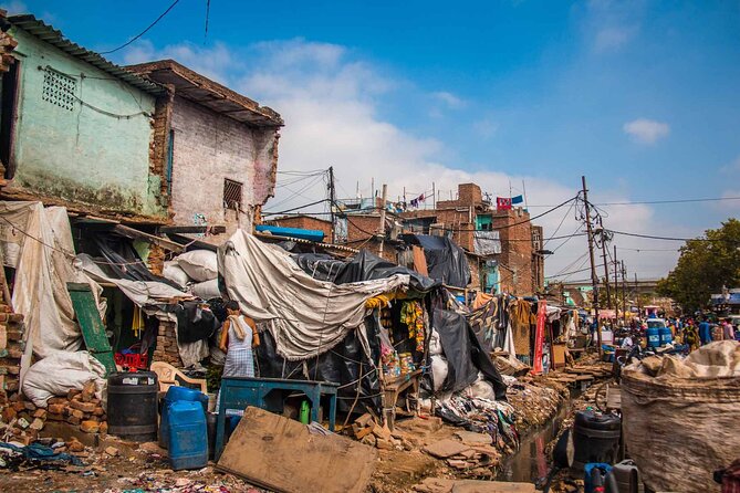 Sanjay Colony Slum Tour - Stop 1 at All Surplus Store: the market scene that sets the tone