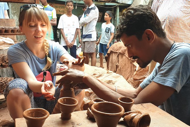Small Group Tour of Dharavi Slum - Mineral water, timing, and comfort for the 2 hours 15 minutes walk